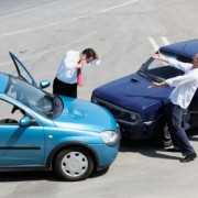 Traffic accident and two drivers fighting