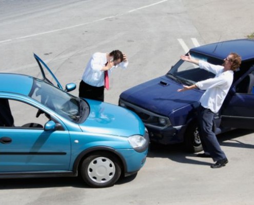 Traffic accident and two drivers fighting