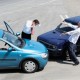 Traffic accident and two drivers fighting